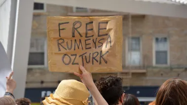Protester holding sign saying Free Ozturk